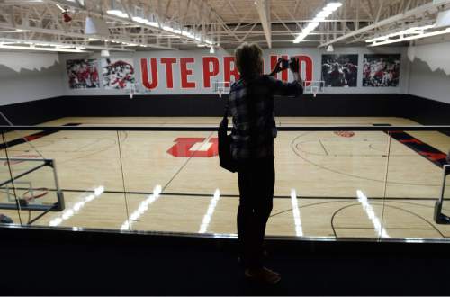Steve Griffin  |  The Salt Lake Tribune

Former University of Utah women's basketball coach Elaine Elliott takes a picture of the women's practice court as guests get the first look at the new Jon M. and Karen Huntsman Basketball Center during grand opening ceremony on the University of Utah campus in Salt Lake City, Thursday, October 1, 2015.