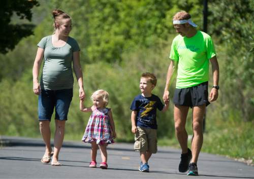 Rick Egan  |  The Salt Lake Tribune

Erica Ward walks with 2-year-old Ellie, 4-year-old Paul, and her husband, 
Jared Ward, a former BYU distance runner. The family recently moved to Park City so Ward can train at altitude for the this summer's Olympic Games in Rio de Janeiro. Tuesday, June 21, 2016.