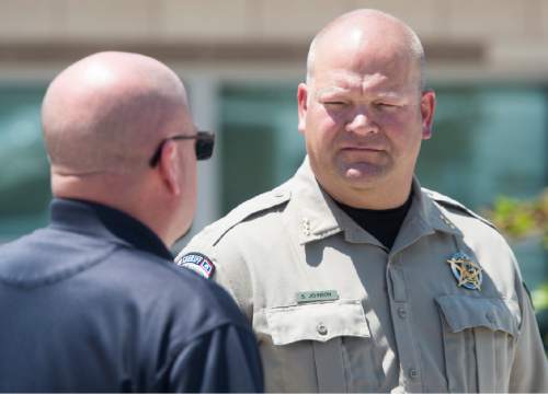Rick Egan  |  The Salt Lake Tribune

Lincoln County Sheriff Shane Johnson (right) visits with an officer  after a press conference about the investigation into the homicide of Utah Transit Authority worker Kay Porter Ricks, at the Justice Center in, Kemmerer, Wyoming.Tuesday, June 28, 2016.