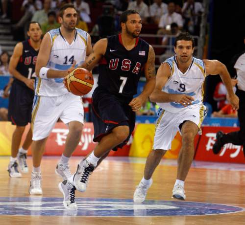 Tribune file photo

USA's Deron Williams dribbles past Argentina's Juan Pedro Gutierrez Llanas, #14, and Antonio Alejandro Porta Pernigotti, #9, during the semifinals game at the Olympic Basketball Gymnasium in Beijing, Friday, August 22, 2008.  USA won the game against Argentina 101-81.