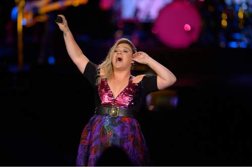 Leah Hogsten  |  The Salt Lake Tribune
Pop singer Kelly Clarkson performs at Usana Amphitheatre in West Valley City on Aug. 8, 2015.