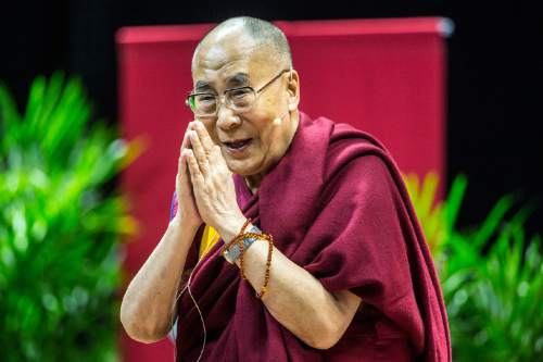 The Dalai Lama greets people as he arrives at the Huntsman Center at the University of Utah in Salt Lake City, Tuesday, June 21, 2016. (Chris Detrick/The Salt Lake Tribune via AP) MANDATORY CREDIT