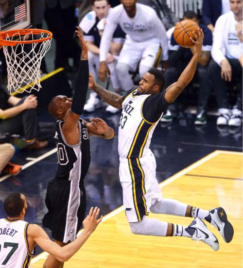 Steve Griffin  |  The Salt Lake Tribune


Utah Jazz forward Trevor Booker (33) soars into the air as he tries to dunk the ball over San Antonio Spurs forward David West (30) during the Jazz versus Spurs NBA basketball game at Vivint Smart Home Arena in Salt Lake City, Tuesday, April 5, 2016. Booker lost control of the ball and it rebounded out to Utah Jazz guard Shelvin Mack (8) who nailed a three pointer.