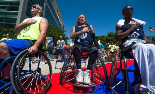 Steve Griffin / The Salt Lake Tribune

Jimmy Green, Paul Jackson and Jake Hipps sing the National Anthem prior to  an exhibition wheelchair basketball game at Vivint SmartHome Arena in Salt Lake City kicking off the 36th National Veterans Wheelchair Games are in Salt Lake City Monday June 27, 2016. This year over 625 athletes from all over the world will converge in Salt Lake City for the games June 27- July 2.