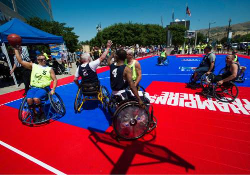 Steve Griffin / The Salt Lake Tribune

Jimmy Greenlooks to pass the ball during an exhibition wheelchair basketball game at Vivint SmartHome Arena in Salt Lake City kicking off the 36th National Veterans Wheelchair Games are in Salt Lake City Monday June 27, 2016. This year over 625 athletes from all over the world will converge in Salt Lake City for the games June 27- July 2.