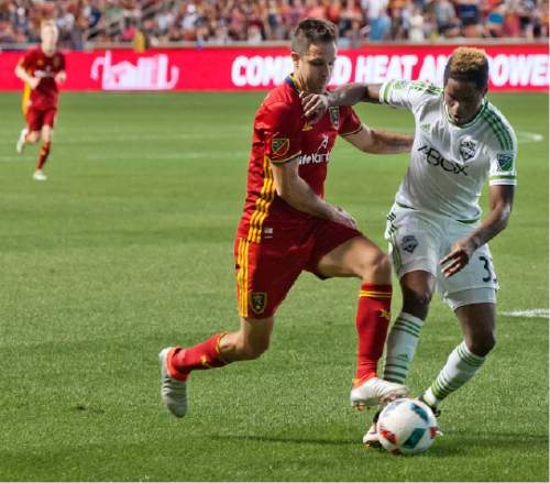 Michael Mangum  |  Special to the Tribune

Seattle Sounders defender Joevin Jones (33) and Real Salt Lake forward Burrito Martinez (7) jockey for posession during their U.S. Open Cup match at Rio Tinto Stadium in Sandy, UT on Tuesday, June 28th, 2016. The match ended in a 1-1 draw with Seattle advancing after winning in a penalty kick shootout.