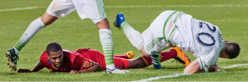 Michael Mangum  |  Special to the Tribune

Real Salt Lake defender Aaron Maund, left, and Seattle Soudners defender Zach Scott (20) both fall to the pitch after battling for the ball during their U.S. Open Cup match at Rio Tinto Stadium in Sandy, UT on Tuesday, June 28th, 2016. The match ended in a 1-1 draw with Seattle advancing after winning in a penalty kick shootout.