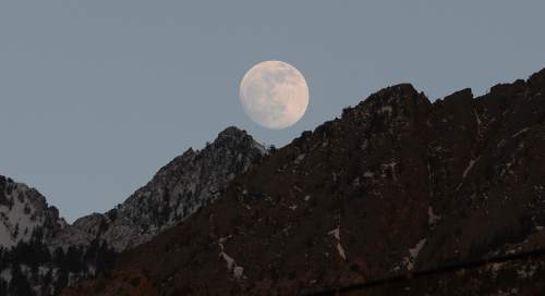Scott Sommerdorf   |  The Salt Lake Tribune
The rising full moon just above the Wasatch range as seen from Olympus High School, Monday, May 12, 2014.