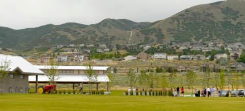 Leah Hogsten  |  The Salt Lake Tribune
Urban farmers and city and county planners and dignitaries celebrated the amenties of Wheadon Farm Regional Park on Wednesday, June, 29, 2016 in Draper. Wheadon Farm Regional Park is one of three regional parks funded by the $47 million Park Bond, authorized by voters in 2012. The Gene and Deane Wheadon farm was a working farm from the early 1900s to 1997, when a conservation easement was placed on the property by the Wheadon family. The 64-acre farm was purchased by Salt Lake County with the 2006 Open Space Bond and master-planned 2008.  Phase I of the park will be constructed.