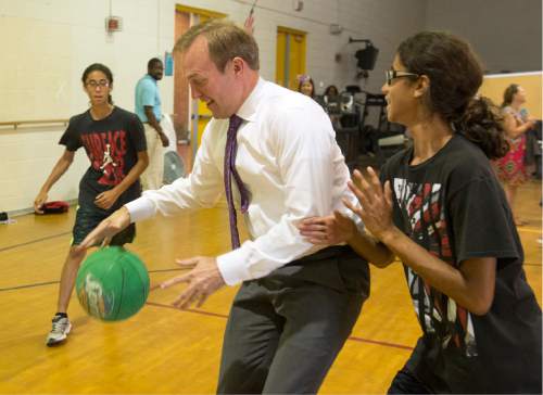 Rick Egan  |  The Salt Lake Tribune

Mayor Ben McAdams plays basketball with some kids in the Youth Services After School Program, at Kearns Junior High School. Thursday, June 30, 2016.
