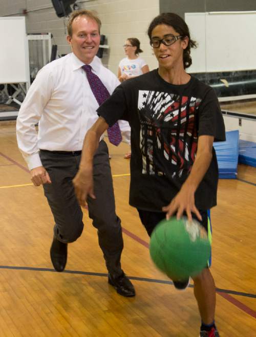 Rick Egan  |  The Salt Lake Tribune

Mayor Ben McAdams plays basketball with some kids in the Youth Services After School Program, at Kearns Junior High School. Thursday, June 30, 2016.