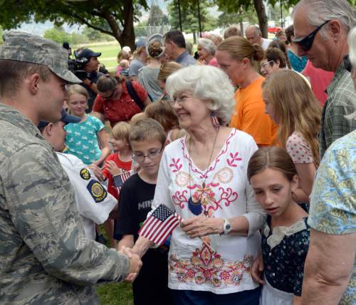 Al Hartmann  |  The Salt Lake Tribune 
Folks greet soldiers and thank them for their service at the Freedom Festival, in Orem Friday July 1 where 16 people were sworn in as new U.S. citizens.