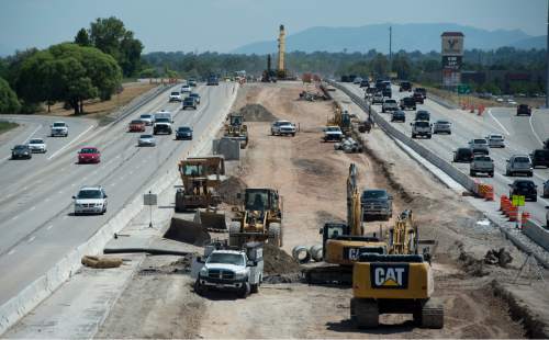 Rick Egan  |  Tribune file photo

Constrution on Interstate 215, looking south from 3100 South, on June 27. The I-215 project between 4700 So. and S.R. 201 is one of just several major construction stretches on Utah roads. Highway officials warn holiday travelers to slow down, observe lower, construction-area speed limits and allow for plenty of time to get to destinations.
