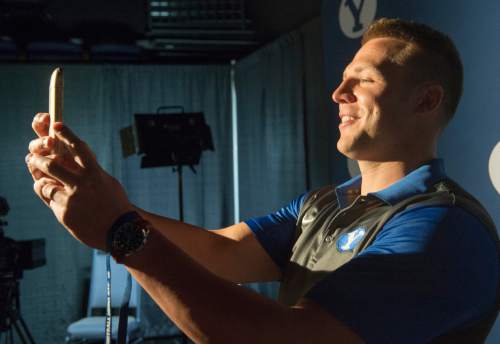 Rick Egan  |  The Salt Lake Tribune

BYU quarterback Taysom Hill takes a selfie for Gabby Heroux at the annual football media day at the Broadcasting Building,Thursday, June 30, 2016.