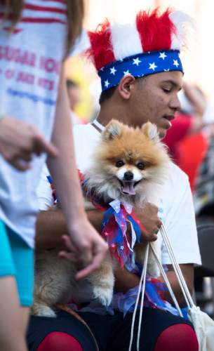 Steve Griffin / The Salt Lake Tribune

Matt McDaniel holds his dog, Mr. Fox, after collecting an award during the second annual Sugar House Pet Parade sponsored by the Sugar House Chamber of Commerce in Salt Lake City Monday July 4, 2016. Dogs and their families walked 1.3 miles from Sugarhouse Park to 2100 south and Highland Drive kicking off the Fourth of July holiday. A portion of the proceeds went to Best Friends Animal Society.
