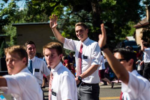 Chris Detrick  |  The Salt Lake Tribune
Mormon missionaries wave to the crowd during the annual Freedom Festival Grand Parade in downtown Provo Monday July 4, 2016.