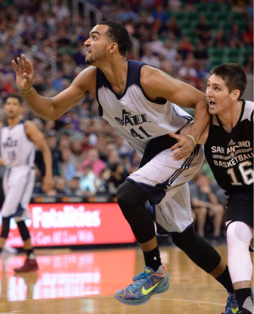 Steve Griffin / The Salt Lake Tribune

Utah Jazz forward Trey Lyles breaks free of a hold from Spurs guard Ryan Arcidiacono during the Jazz versus Spurs summer league game at the Vivint Smart Home Arena in Salt Lake City Monday July 4, 2016.