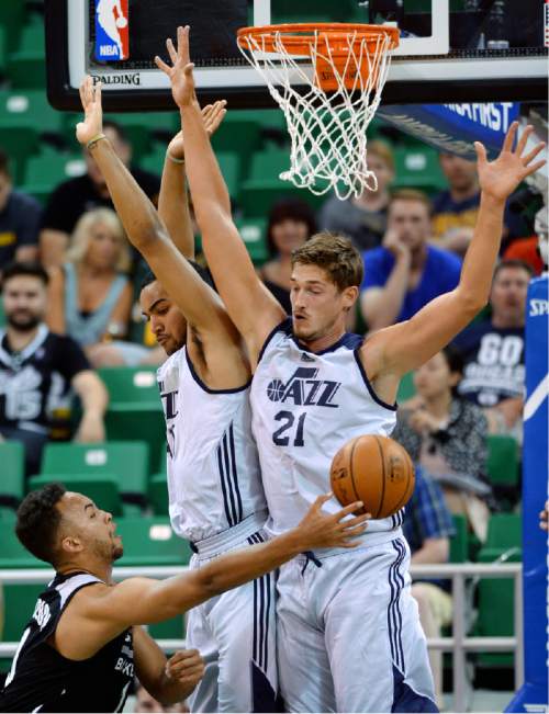 Steve Griffin / The Salt Lake Tribune

Utah Jazz forward Trey Lyles and center Tibor Pleiss block the path of Spurs  guard Kyle Anderson during the Jazz versus Spurs summer league game at the Vivint Smart Home Arena in Salt Lake City Monday July 4, 2016.