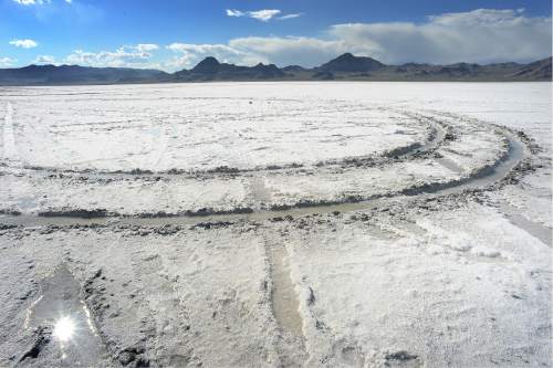 Scott Sommerdorf   |  The Salt Lake Tribune  
Tire tracks left on the salt flats by an unknown driver, despite the numerous signs warning motorists to stay off the salt flats near the Bonneville Speedway.