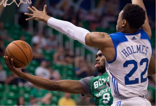 Steve Griffin / The Salt Lake Tribune

Boston's Jaylen Brown scoops a shot under the arm of  Philadelphia's Rican Holmes during summer league game  at the Vivint Smart Home Arena in Salt Lake City Monday July 4, 2016. Brown was the 3rd overall pick in the 2016 NBA draft.