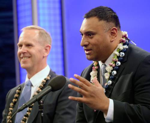 Al Hartmann  |  The Salt Lake Tribune
Kalani Sitake is announced as BYU's new head coach at a press conference in Provo Monday Dec. 21.  He answers questions with BYU Athletic Director Tom Holmoe, left.