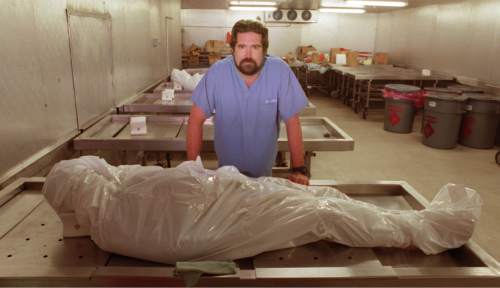 Tribune file photo
Todd Grey, seen here in a 1997 file photo, is retiring as the State Chief Medical Examiner for the state of Utah.