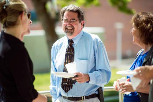 Chris Detrick  |  The Salt Lake Tribune
Utah State Medical Examiner Todd Grey talks with friends and colleagues at the State Medical Examiner's Office Thursday June 30, 2016.