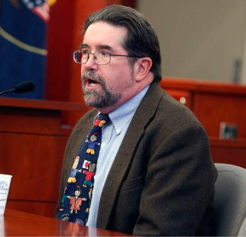 Al Hartmann  |  The Salt Lake Tribune
Dr. Todd Grey, Utah Medical Examiner,  testifies in Esar Met's preliminary hearing in Judge William Barrett's District Court in Salt Lake City Thursday November 8 . Esar Met is accused of killing 7-year-old Hser Ner Moo in 2008.
