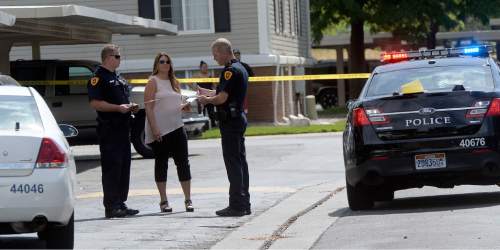 Al Hartmann  |  The Salt Lake Tribune 
Salt Lake City Police interview witnesses at the scene of a drive-by shooting Wednesday, July 6, 2016 at the City Park apartment complex parking area at 750 N. 900 West.  One person was injured and transported to the hospital.