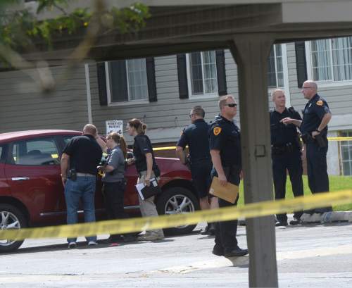 Al Hartmann  |  The Salt Lake Tribune 
Salt Lake City police at the scene of a drive-by shooting Wednesday, July 6, 2016 at City Park apartment complex parking area at 750 N. 900 West.  One person was injured and transported to the hospital.