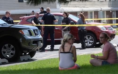 Al Hartmann  |  The Salt Lake Tribune 
Salt Lake City police at the scene of a drive-by shootingWednesday, July 6, 2016 at City Park apartment complex parking area at 750 N. 900 West.  One person was injured and transported to the hospital.