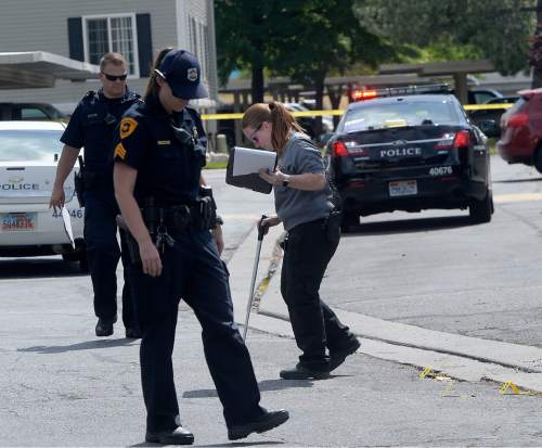 Al Hartmann  |  The Salt Lake Tribune 
Salt Lake City police at the scene of a drive-by shooting Wednesday, July 6, 2016 at City Park apartment complex parking area at 750 N. 900 West.  One person was injured and transported to the hospital.