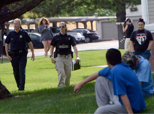 Al Hartmann  |  The Salt Lake Tribune 
Salt Lake City Police at the scene of a drive-by shooting Wednesday, July 6, 2016 at City Park apartment complex parking area at 750 N. 900 West.  One person was injured and transported to the hospital.