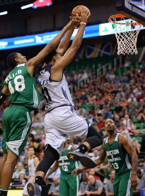 Steve Griffin / The Salt Lake Tribune

Utah Jazz forward Trey Lyles drives past Boston's Malcolm Miller and throws down a dunk during the Jazz versus Celtics summer league game at the Vivint Smart Home Arena in Salt Lake City Tuesday July 5, 2016. Lyles was called for an offensive foul on the play.