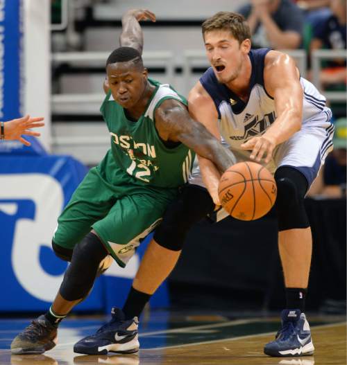 Steve Griffin / The Salt Lake Tribune

Boston's Terry Rozier, left, knocks the ball away from Utah Jazz center Tibor Pleiss during the Jazz versus Celtics summer league game at the Vivint Smart Home Arena in Salt Lake City Tuesday July 5, 2016.