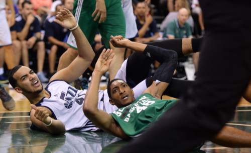 Steve Griffin / The Salt Lake Tribune

Utah Jazz forward Trey Lyles, left, and Boston's Malcolm Miller look at the ref as the crash to the floor during the Jazz versus Celtics summer league game at the Vivint Smart Home Arena in Salt Lake City Tuesday July 5, 2016. Lyles was called for an offensive foul on the play.
