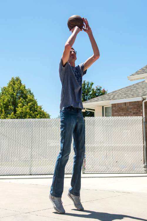 Chris Detrick  |  The Salt Lake Tribune
Alan Hamson,  7-foot-3, plays basketball at his home in Lindon Tuesday May 31, 2016.