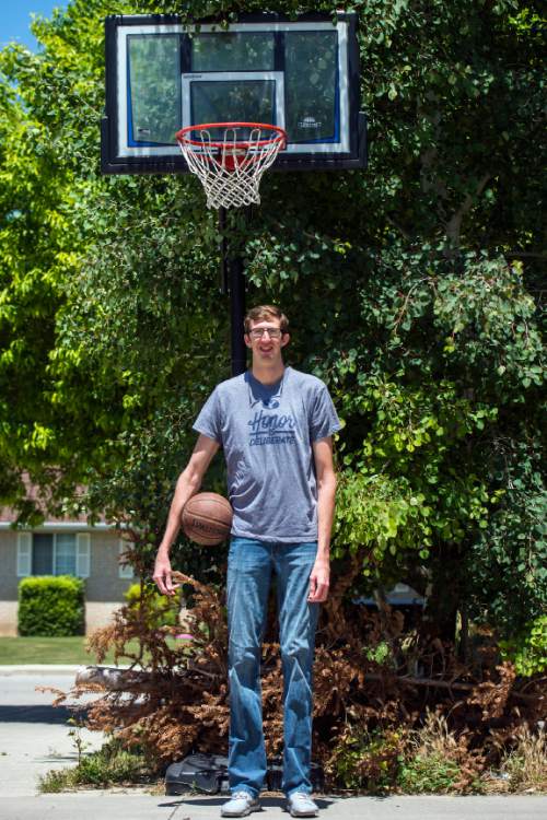Chris Detrick  |  The Salt Lake Tribune
Alan Hamson,  7-foot-3, poses for a portrait at his home in Lindon Tuesday May 31, 2016.