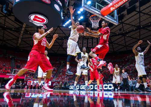 Trent Nelson  |  The Salt Lake Tribune
Utah Utes guard Kenneth Ogbe (25) passes to forward Chris Reyes (20) as Alabama State Hornets guard Bobby Brown (5) defends as the University of Utah Utes host the Alabama State Hornets, college basketball at the Huntsman Center in Salt Lake City, Saturday November 29, 2014.