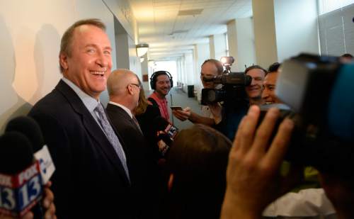 Al Hartmann |  The Salt Lake Tribune
Former Utah Attorney General Mark Shurtleff, left, laughs as his attorney Richard Van Wagonner talks to the media outside Judge Randall Skanchy's courtroom in Salt Lake City Monday June 15 after a preliminary hearing.