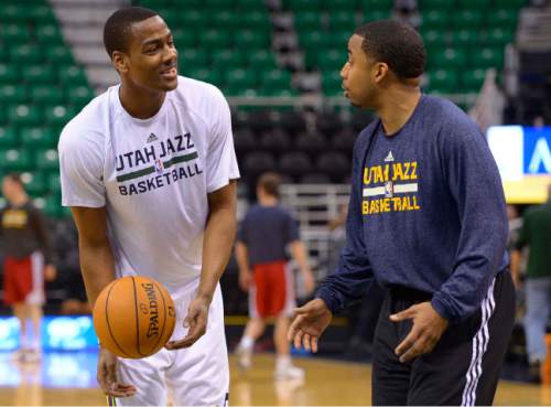 Leah Hogsten  |  The Salt Lake Tribune Utah Jazz point guard Alec Burks (10) warms up on the court with team assistant Johnnie Bryant prior to their matchup against the Cleveland Cavaliers, Friday, January 10, 2014 at Energy Solutions Arena. Gordon Hayward will not play due to a hip injury.