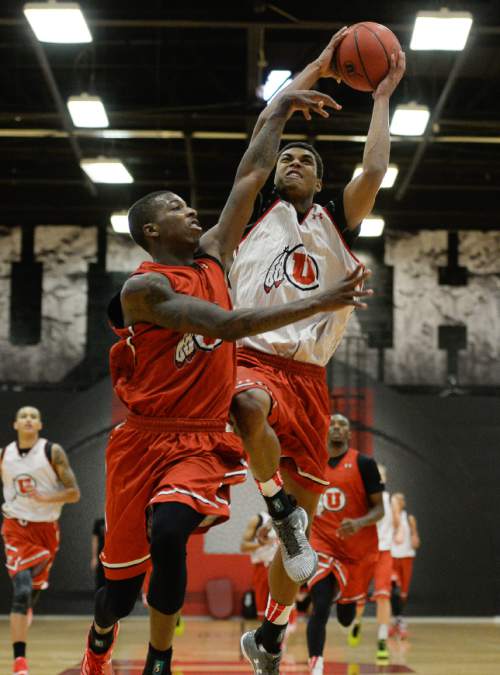 Francisco Kjolseth  |  The Salt Lake Tribune
Kenneth Ogbe, right, gets past Delon Wright on his drive to the basket during a recent practice. Utah's new motion offense should free up playmakers to take more initiative on the court.