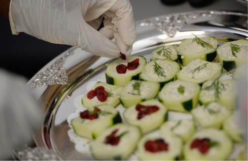 Francisco Kjolseth | The Salt Lake Tribune
Saba Wilson applies the finishing touches to cucumber cups filled with artichoke dip as part of the Culinary Command, a free training program for veterans and active military.