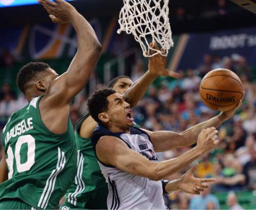 Steve Griffin / The Salt Lake Tribune

Utah Jazz guard Marcus Paige gets past the Boston defense but can't make the basket during the Jazz versus Celtics summer league game at the Vivint Smart Home Arena in Salt Lake City Tuesday July 5, 2016.
