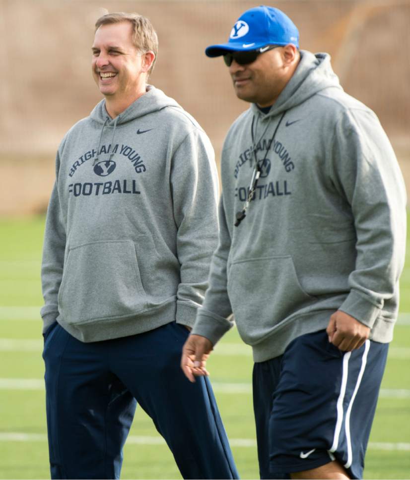 Rick Egan  |  The Salt Lake Tribune

BYU quarterback coach Ty Detmer and head coach Kalani Sitake  share a laugh with on the second day of spring practice, in Provo, Thursday, March 3, 2016.