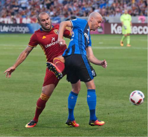 Michael Mangum  |  Special to the Tribune

Real Salt Lake forward Yura Movsisyan (14) challenges Montreal Impact defender Laurent Ciman (23) for the ball during their MLS match at Rio Tinto Stadium in Sandy, UT on Saturday, July 9th, 2016.