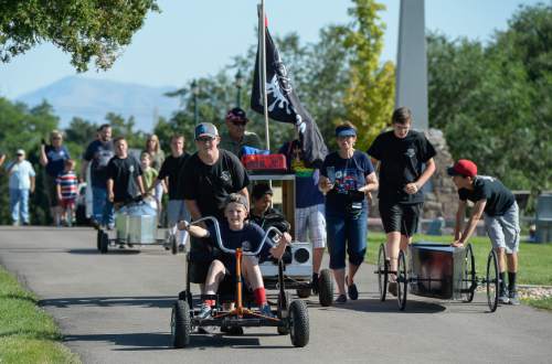Francisco Kjolseth | The Salt Lake Tribune
Scout Troop 708 known as the "Dirty Pigs" show up with four carts as kids compete in the 6th annual American Fork Gravity Soap Box Derby on Thursday July 7th, 2016.