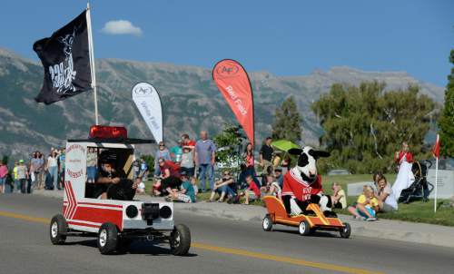 Francisco Kjolseth | The Salt Lake Tribune
Eric Godfrey, 12, takes on the Milk cow with the Fire Truck as kids compete in the 6th annual American Fork Gravity Soap Box Derby on Thursday July 7th, 2016.