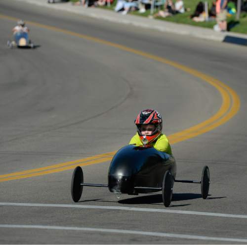Francisco Kjolseth | The Salt Lake Tribune
Tavin Lawrent, 10, pulls out an easy with with T-Rex as kids compete in the 6th annual American Fork Gravity Soap Box Derby on Thursday July 7th, 2016.