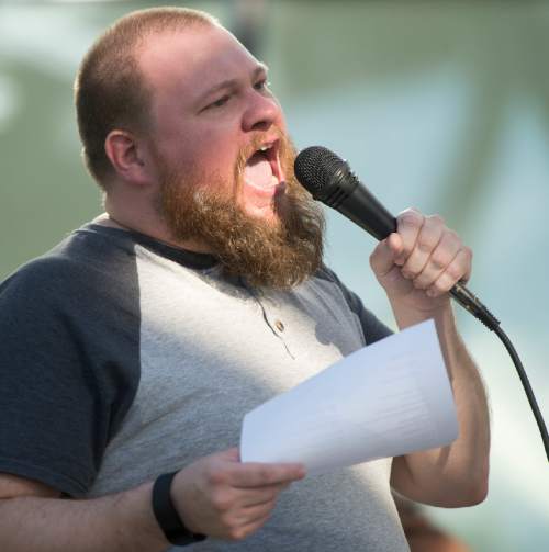Rick Egan  |  The Salt Lake Tribune

Jacob Johnsen speaks at the protest against police brutality to support the protests in Baton Rouge and St. Paul, at the Salt Lake City Public Safety Building, Saturday, July 9, 2016.